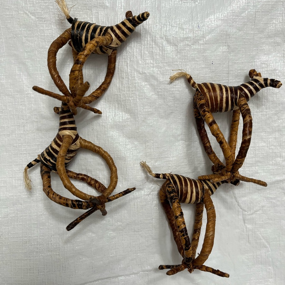 Four hand woven napkin holders